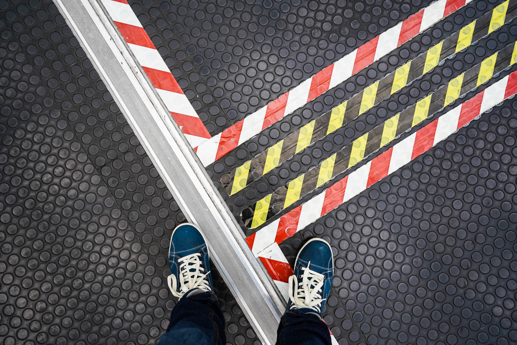  Red-white and red-yellow tape on floor